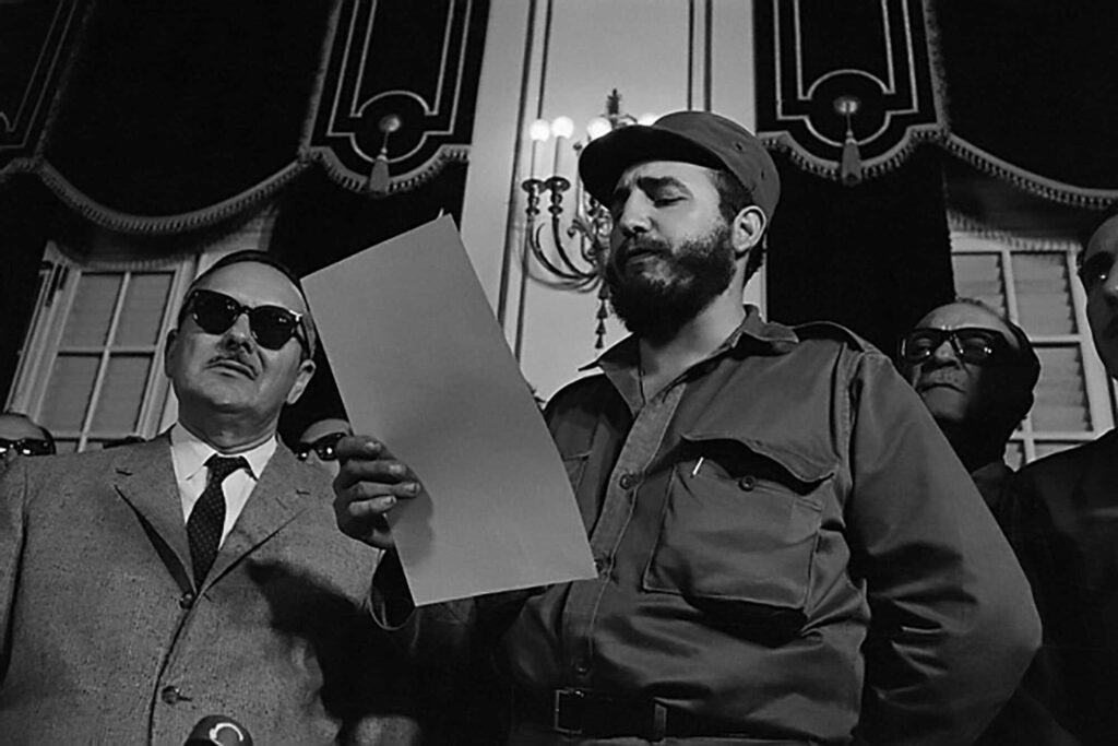 1961 Fidel Castro declares Cuba a socialist nation and bans elections