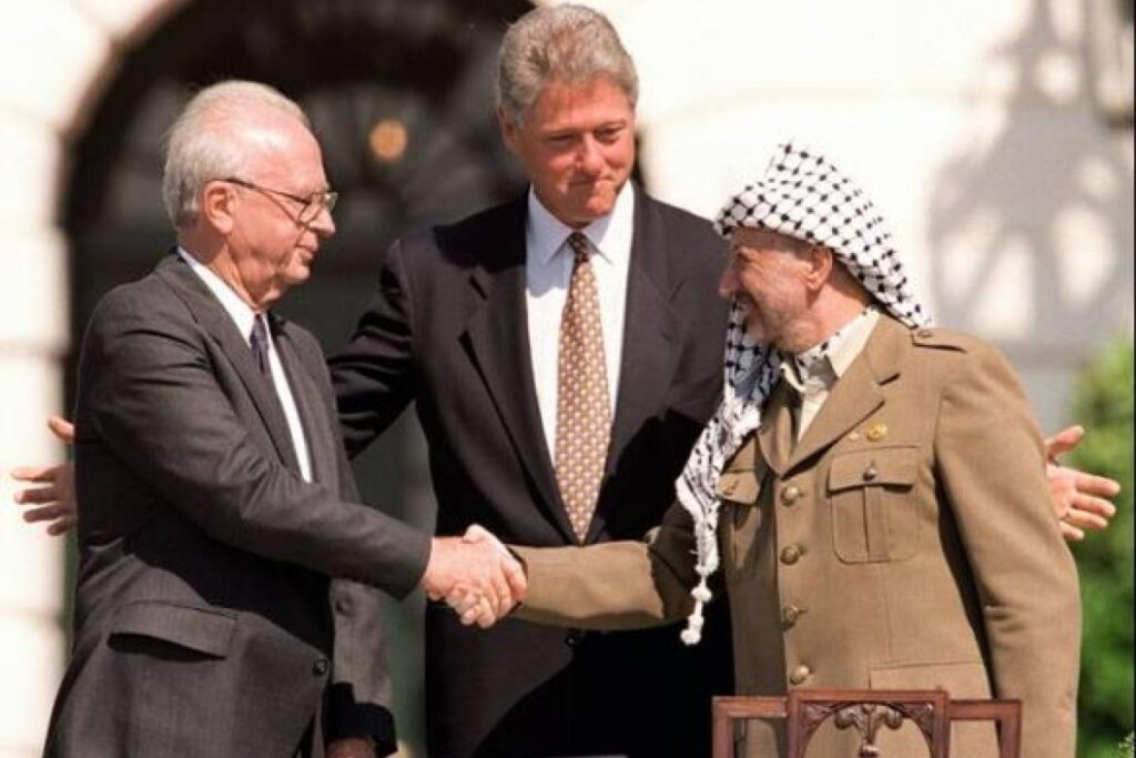 1994 Yitzhak Rabin and Yasser Arafat sign a peace accord to ensure Palestinian self-rule in Gaza and Jericho